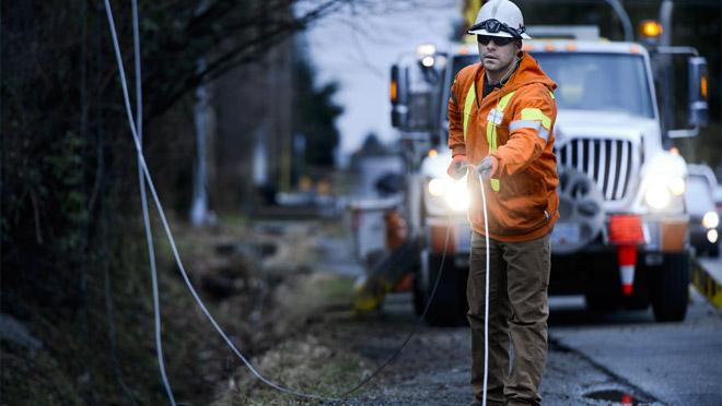 Image of Power Line Technician repairing downed line Image of Power Line Technician repairing downed line