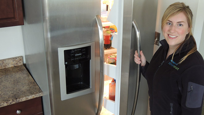 Image of Renee Monty opening refrigerator Tips to keep your refrigerator running smoothly