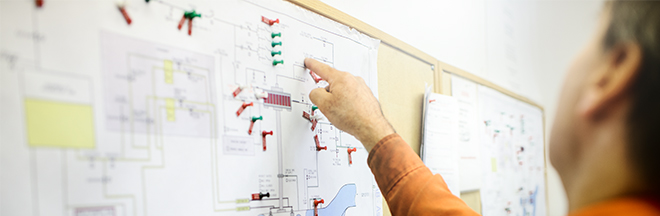 man explaining a technical diagram man explaining a technical diagram