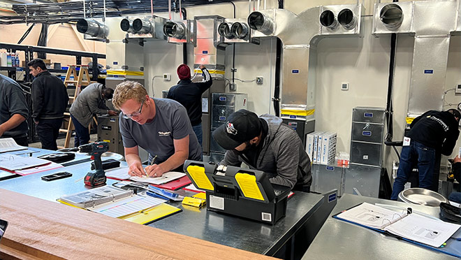 Students attending BCIT's Residential Air Source Heat Pump Installation Skills course Students attending BCIT's Residential Air Source Heat Pump Installation Skills course