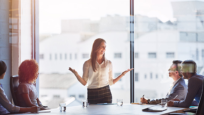 Image of business people in a brightly-lit conference room Image of business people in a brightly-lit conference room