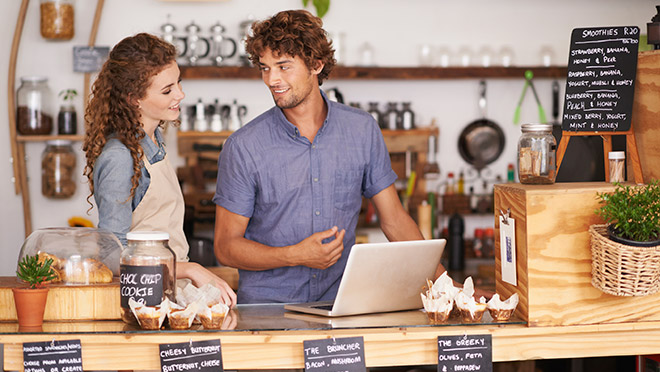 Image of cafe workers with laptop computer Image of cafe workers with laptop computer