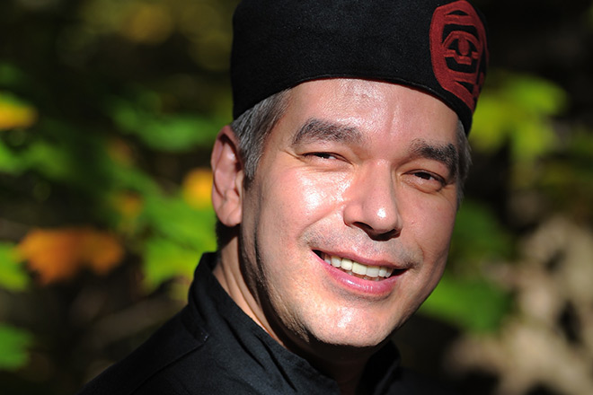 Chef David Wolfman wearing a black chef's hat