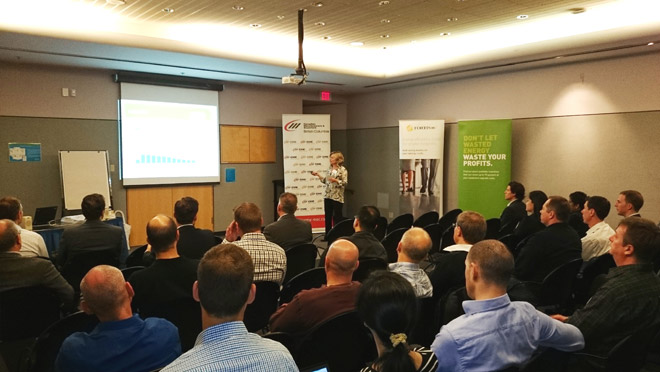 Image of crowd and presenter at a Canadian Manufacturers and Explorers energy efficiency workshop with BC Hydro and FortisBC Image of crowd and presenter at a Canadian Manufacturers and Explorers energy efficiency workshop with BC Hydro and FortisBC