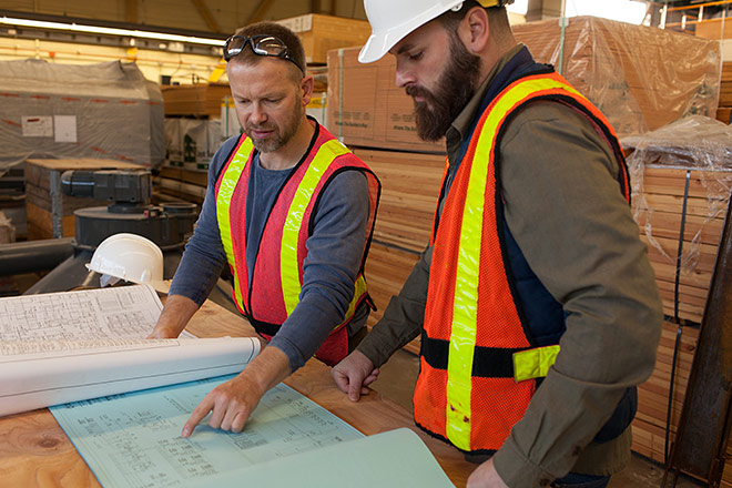 Image of contractors looking at building plans Image of contractors looking at building plans