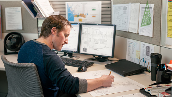 Image of design specialist sitting at a desk Image of design specialist sitting at a desk