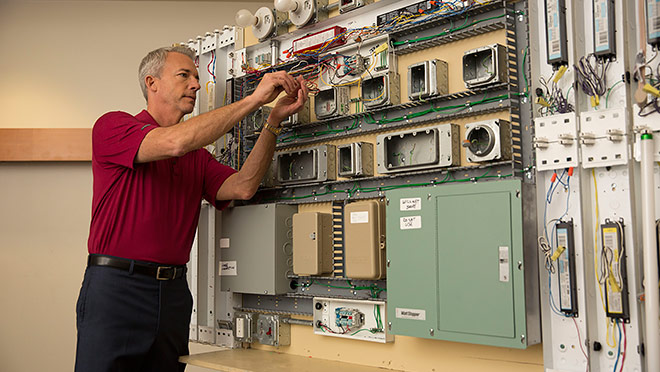 Image of instructor with electrical board Image of instructor with electrical board