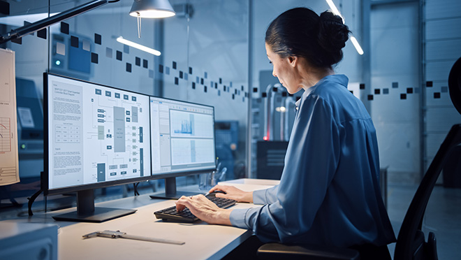 An engineer working in an industrial facility office