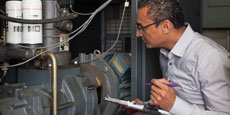 Man checking a compressor.