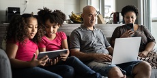 Family using electronic devices