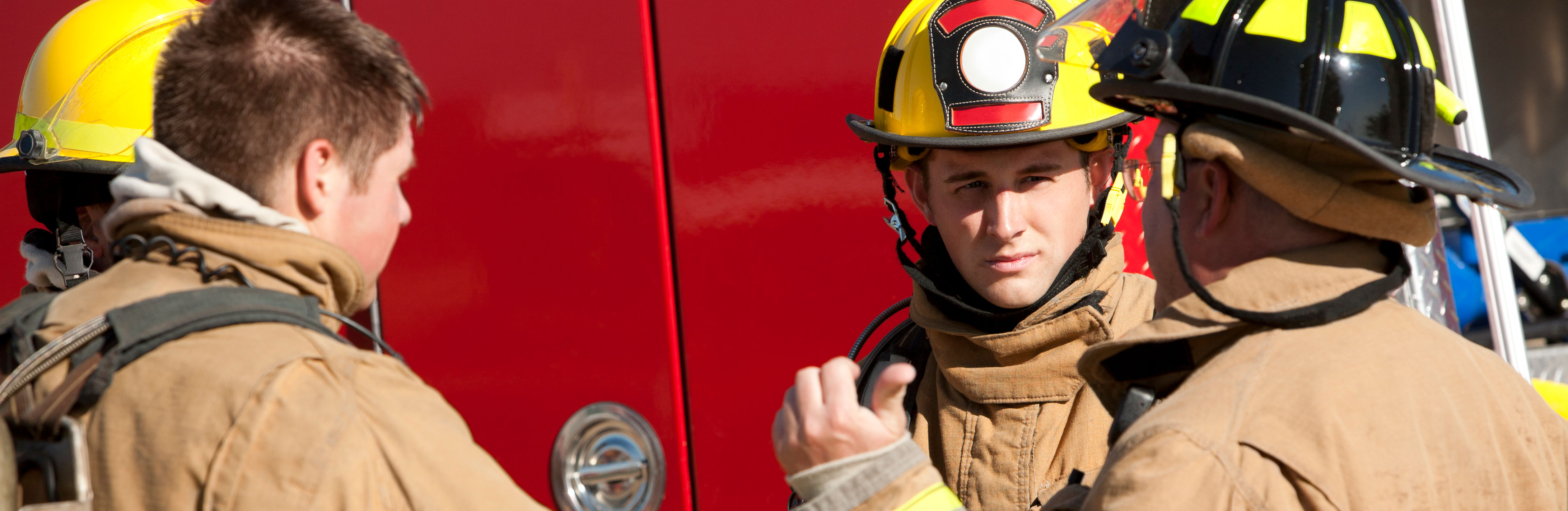 Fire fighters in front of fire truck Fire fighters in front of fire truck