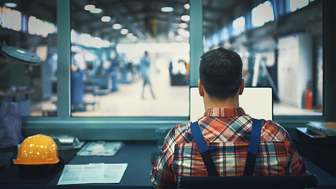 Image of a worker in an office at an industrial plant Image of a worker in an office at an industrial plant