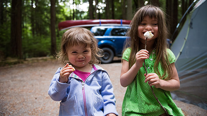 Image of kids eating marshmallows while camping in B.C.