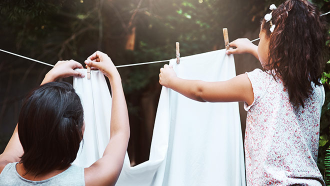 Image of kids hanging laundry to dry