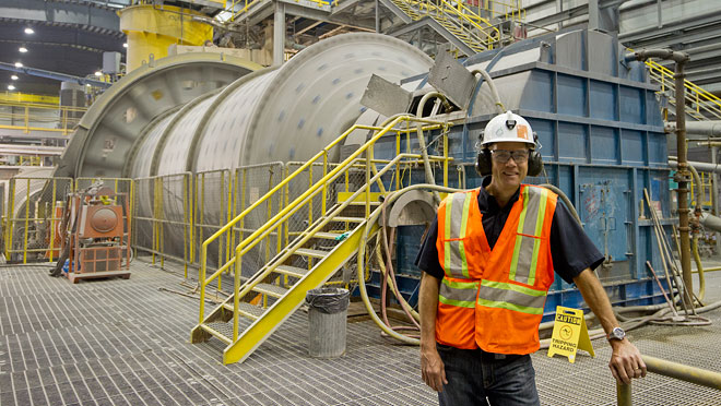 Andrew Cooper stands in front of a mill at the Kamloops-area facility. 