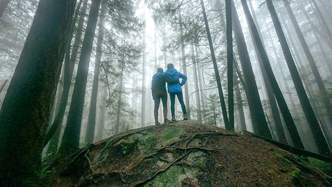 Two hikers standing in fog on a North Vancouver, B.C. hike