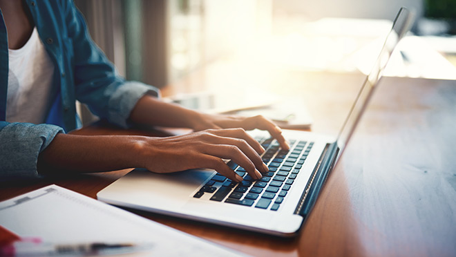 Image of person using a laptop computer