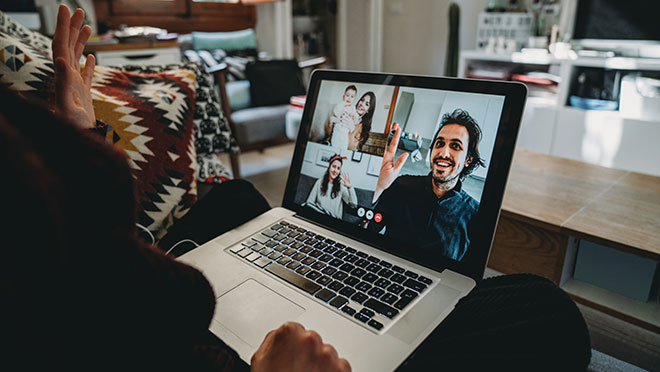 Image of a woman connecting with family members online