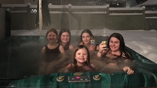 Image of girls enjoying the Rasberry family hot tub