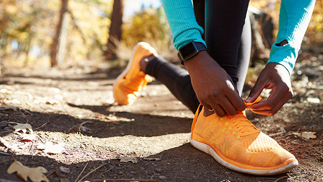 Image of a runner wearing a smart watch Image of a runner wearing a smart watch