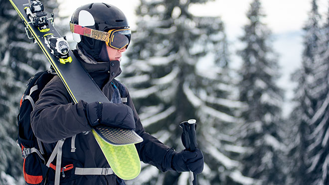 Image of a skiier wearing a helmet Image of a skiier wearing a helmet