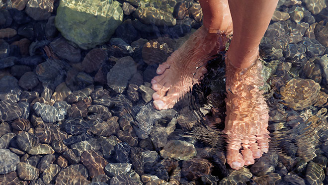 A person standing in cool water