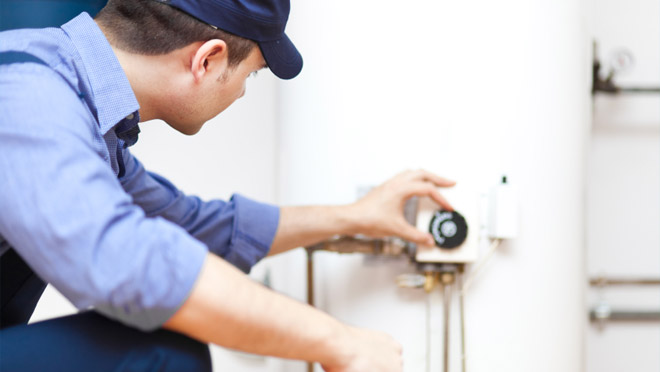 What does a technician look for when inspecting a water heater?