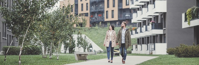 Two people walking in a residential area Two people walking in a residential area