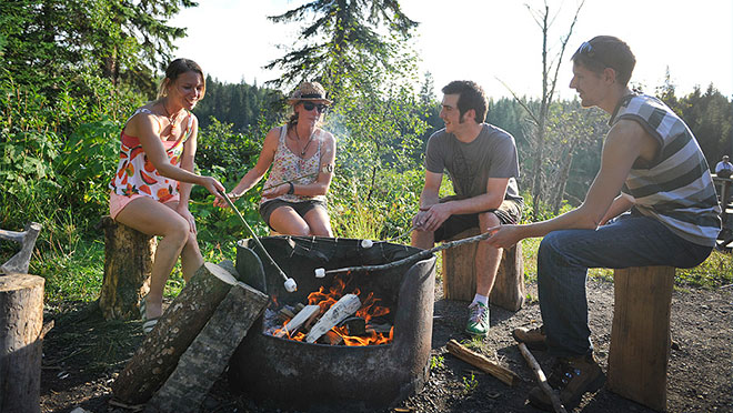 Image of UNBC students sitting at a campfire