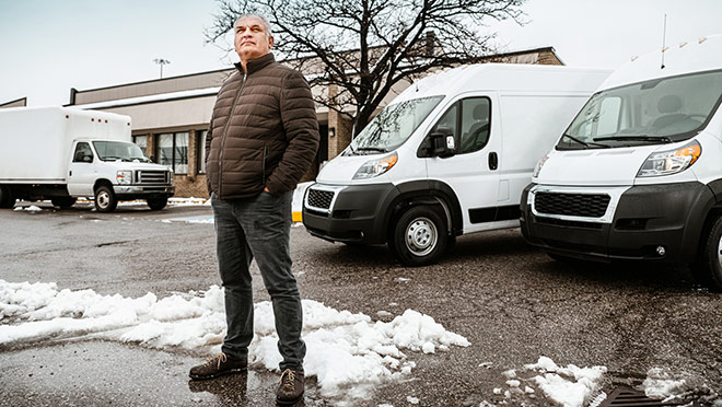 Man standing in front of commercial vans