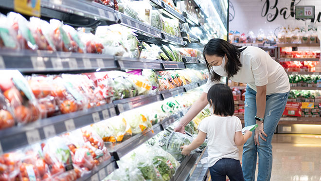 Image of a mother and child shopping in a supermarket