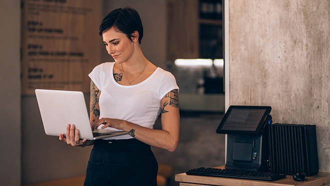 Woman carrying a laptop computer