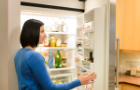 Woman looking in a fridge Woman looking in a fridge