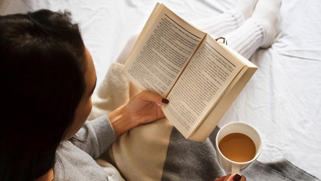 Image of a woman reading a book