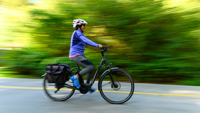 Image of a woman riding an e-bike