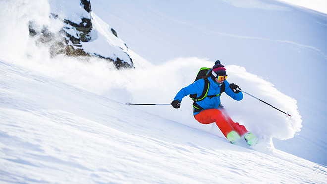 Image of woman skiing in fresh powder Image of woman skiing in fresh powder
