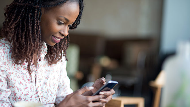 Image of a woman using a smartphone Image of a woman using a smartphone