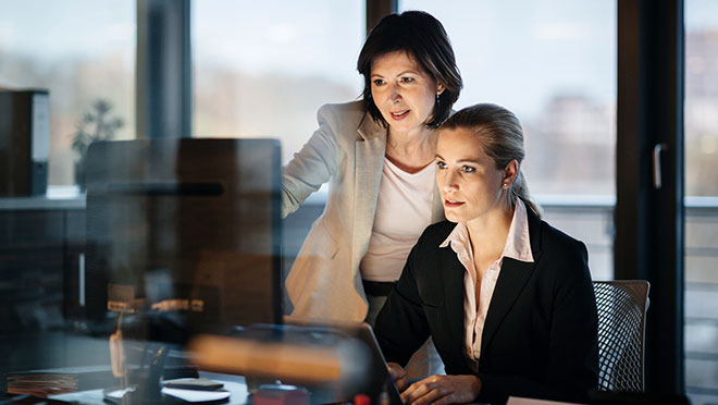 Image of two women working in an office Image of two women working in an office