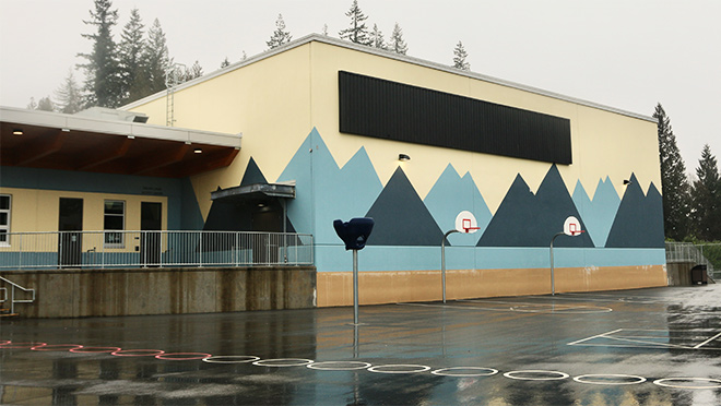 Smiling Creek Elementary School outdoor basketball court in rain