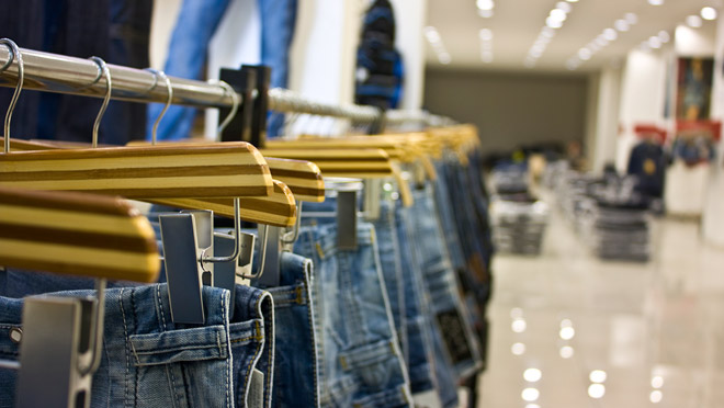 Image of jeans hanging on a clothing shop rack Image of jeans hanging on a clothing shop rack