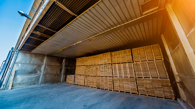 Lumber ready for loading into a dry kiln