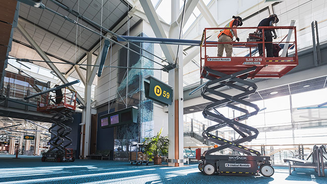 Crew working on an LED lighting upgrade at YVR airport