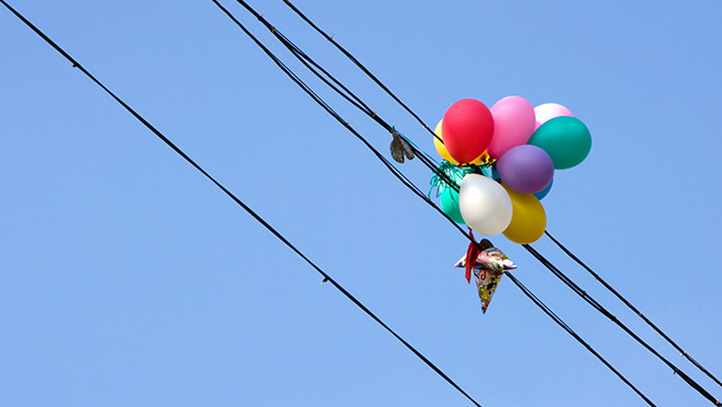 Image of balloons caught on electrical wires Image of balloons caught on electrical wires