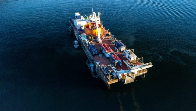 The conductors were retrieved using a barge with a cable reel. 