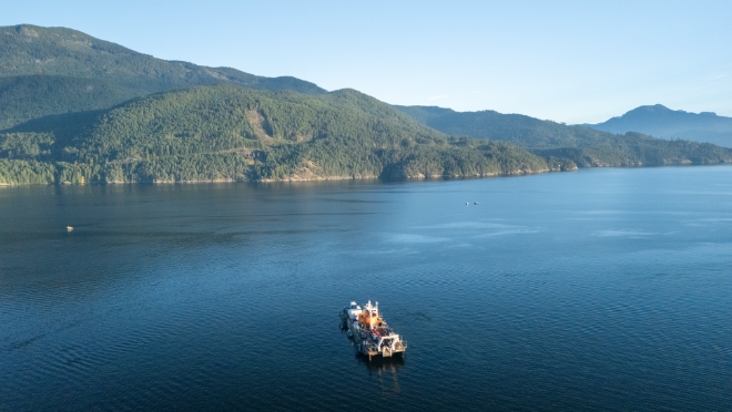 The barge and safety vessels in Jervis Inlet during the retrieval of the conductor.