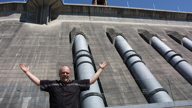 Visitor at Revelstoke Dam Vernon's Derrick Hiebert poses in front of Revelstoke penstocks after visiting the Dam Visitor Centre.