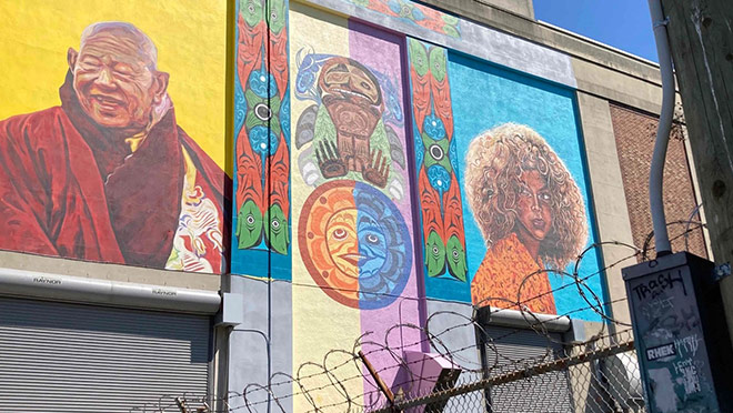 Image of the three-panel 'Solidarity Storytelling' mural at Vancouver's Murrin Substation
