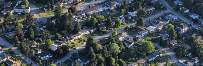 Aerial view from an airplane of residential homes. Aerial view from an airplane of residential homes.