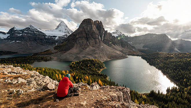 A hiker taking in the view from the Niblet in B.C.'s Mount Assiniboine Provincial Park