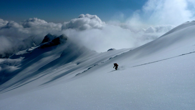 Heli skiing near Revelstoke Skier makes fresh tracks during heli-skiing in the Revelstoke area.